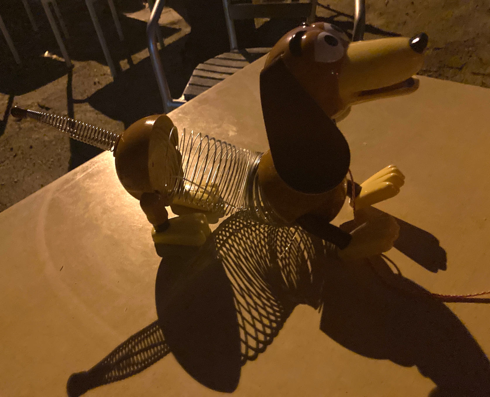 Slinky Dog stretching on table with accompanying shadow effect.