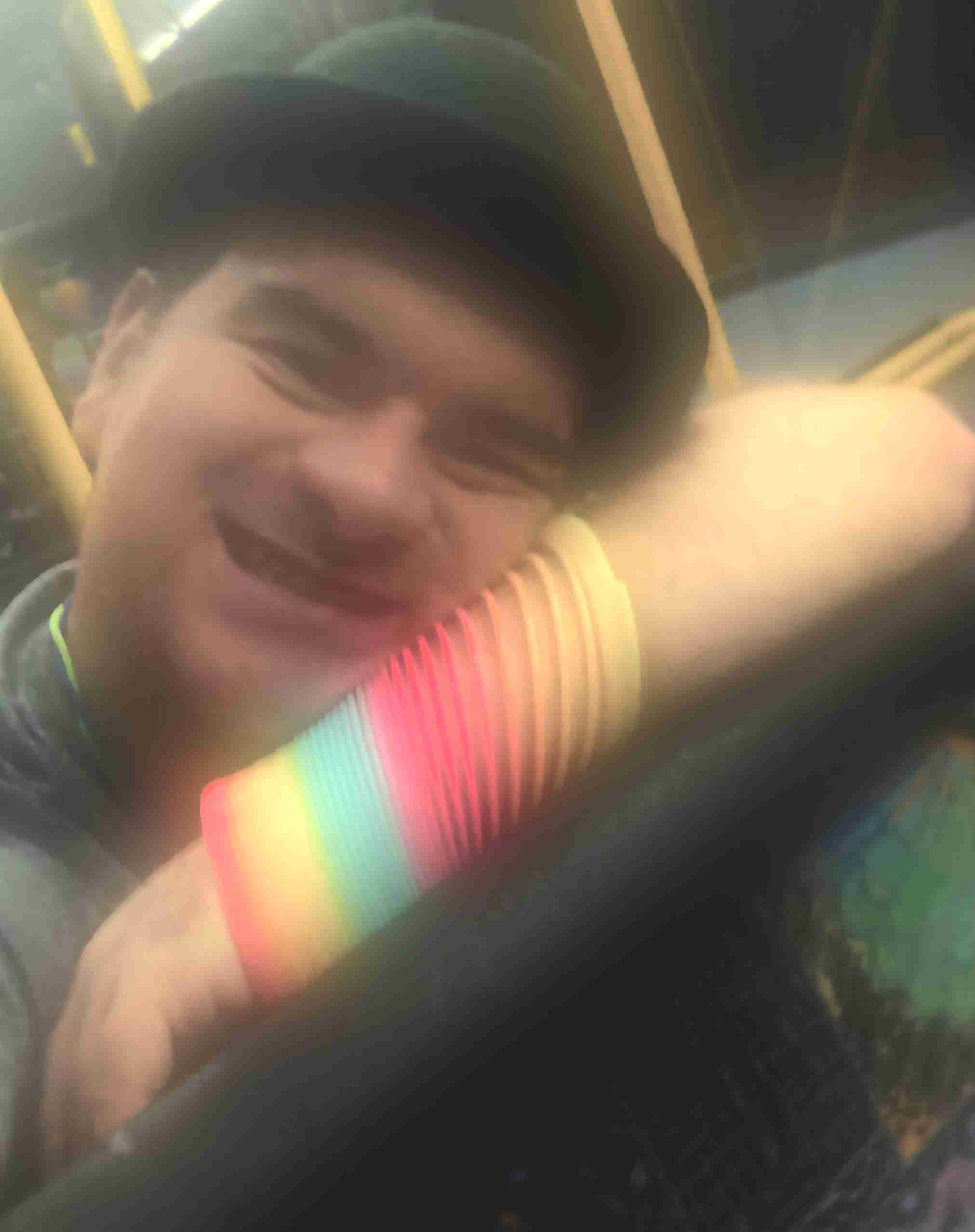 Slinkyfam cute smile rainbow slinky on hand bowler hat