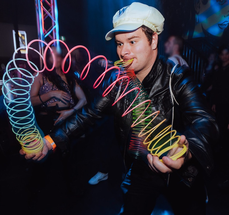 Slinkyfam doing slinky tricks with another slinky in his mouth