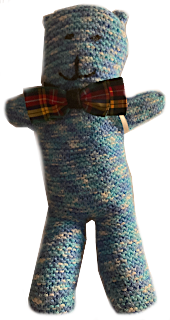 Blue smiling fluffy plush toy wearing bowtie