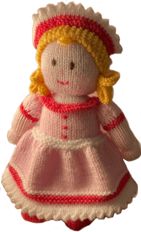 Crochet doll wearing pink dress and white hat yellow hair 